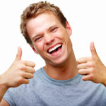 Happy young male showing thumb's up sign